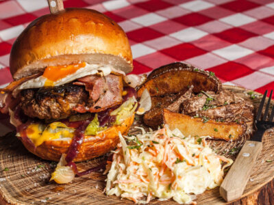 meat-burger-with-coleslaw-on-side-and-brown-handled-fork-156114.jpg